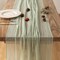 120-inch (10 ft) green cheesecloth table runner, perfect for adding a rustic boho touch to weddings, baby showers, bridal showers, or home décor. This sheer gauze runner serves as an elegant centerpiece, ideal for creating a soft, textured look on an